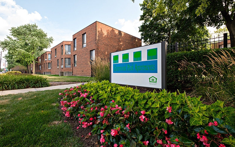 Greenwood Park Apartments sign and flowers