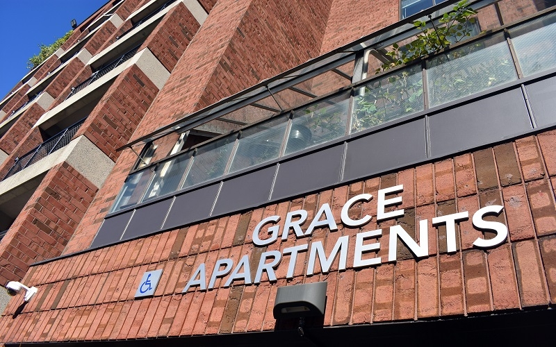Grace Apartments close up of sign