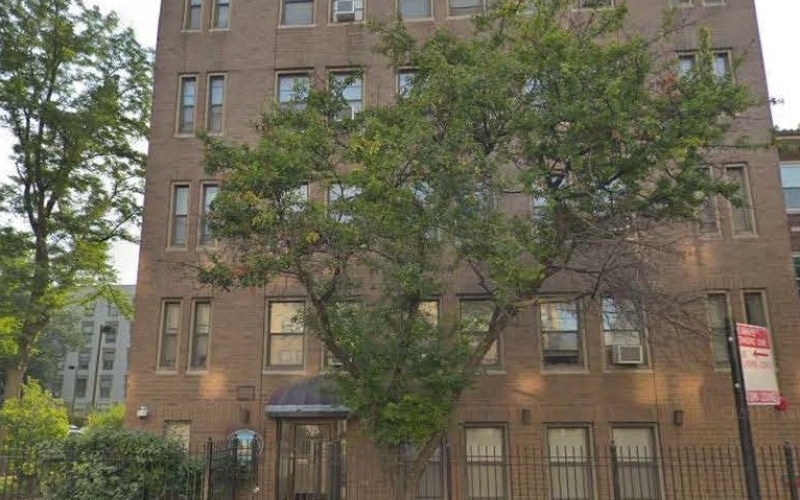 Corcoran Place Apartments brick exterior & trees