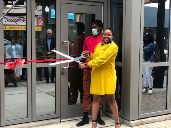 Vershawn Sanders-Ward cutting ribbon