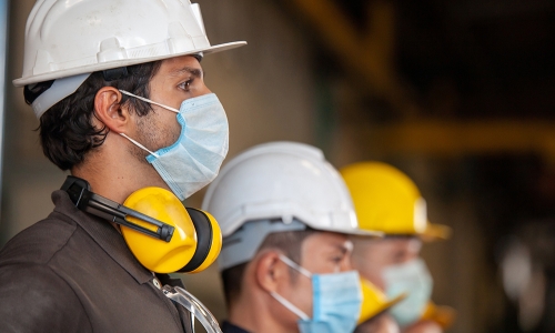 Construction workers wearing protective gear
