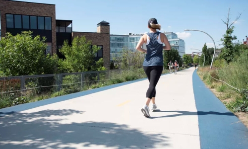 Woman running down path